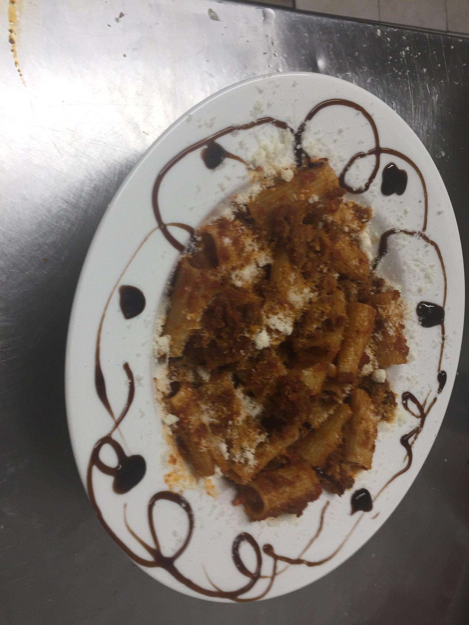 Plated rigatoni with a balsamic swirl at L'Angolo Bianco