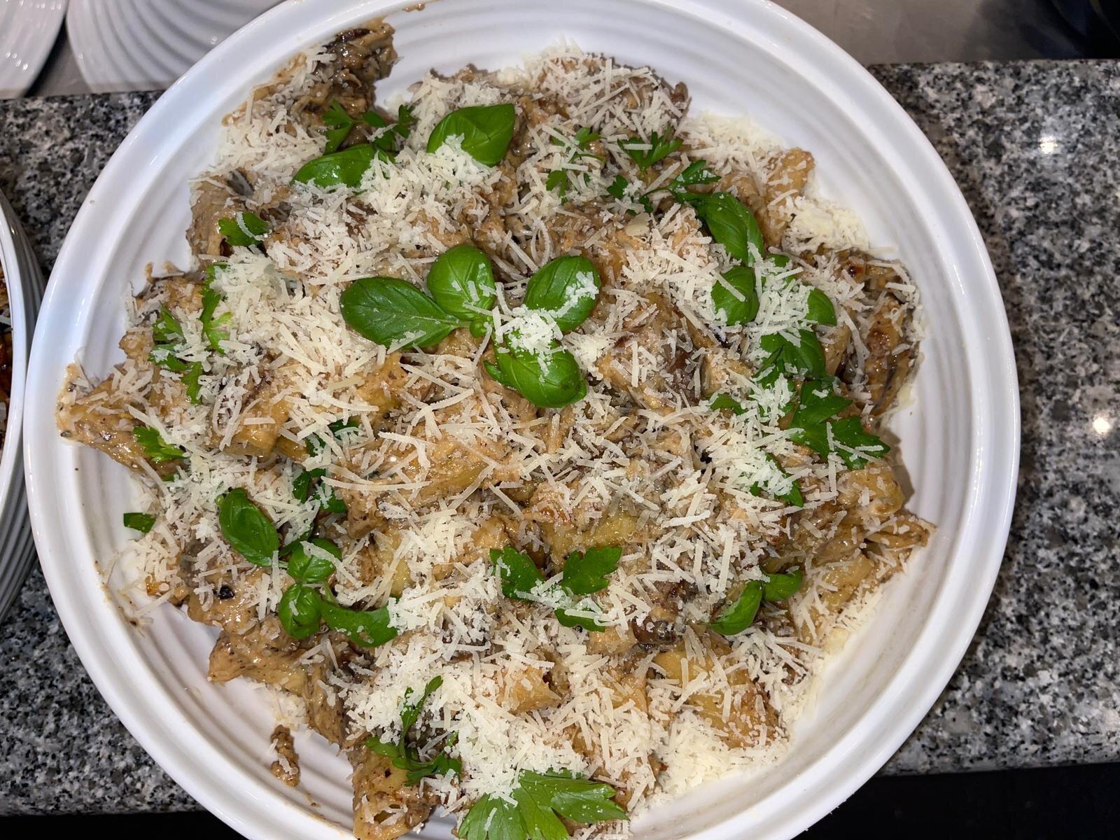 Handmade mushroom pasta with basil and parmesan at L'Angolo Bianco