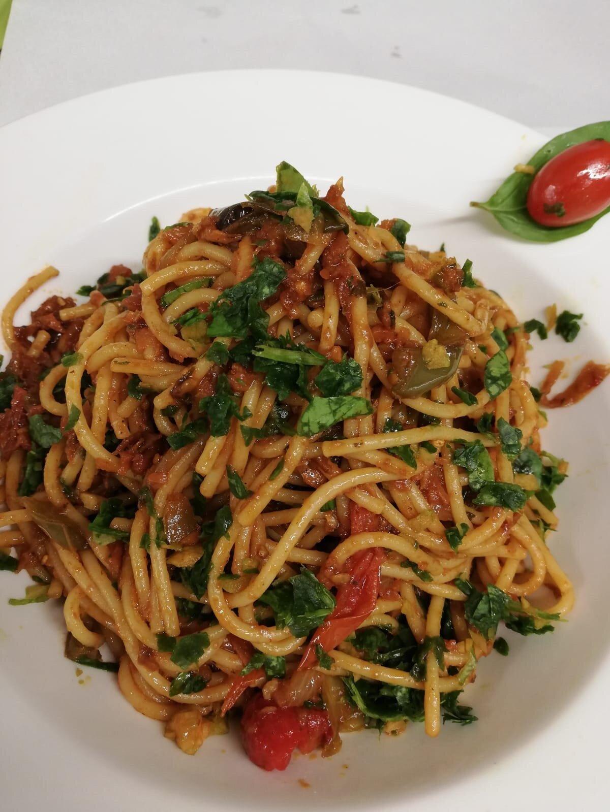Spaghetti with tomato, herbs and a cherry tomato at L'Angolo Bianco