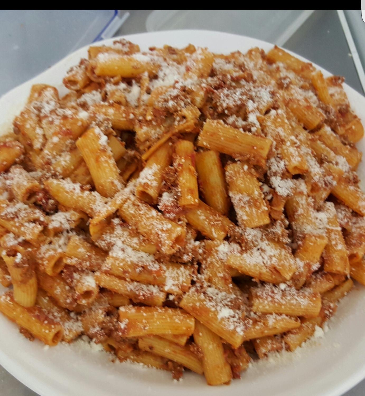 Rigatoni Bolognese with grated cheese at L'Angolo Bianco