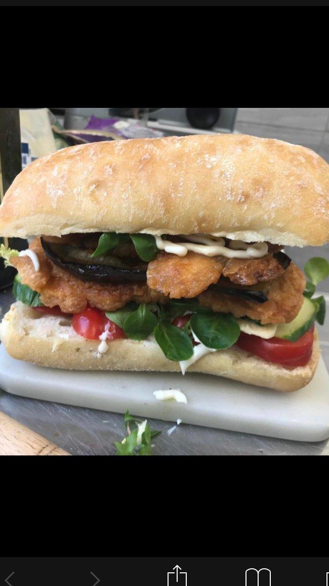 Chicken escalope sandwich on ciabatta with salad at L'Angolo Bianco